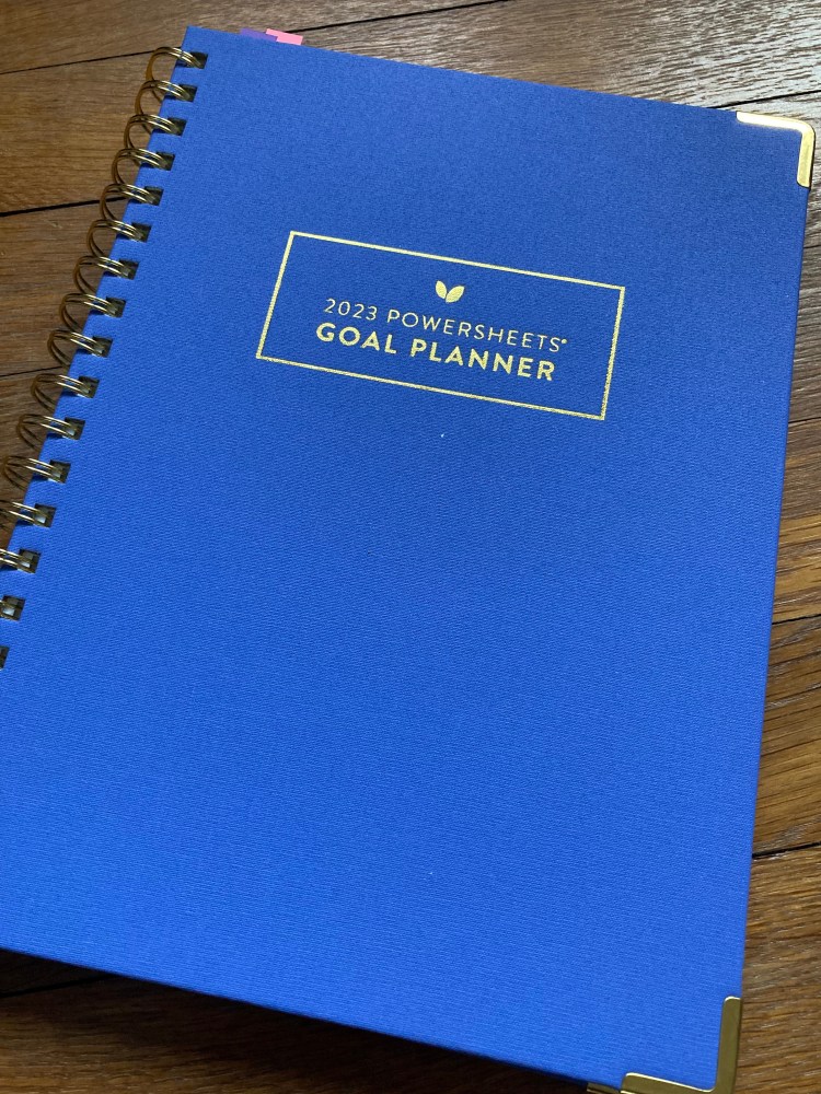 2023 PowerSheets goal planner with a beautiful blue cover.